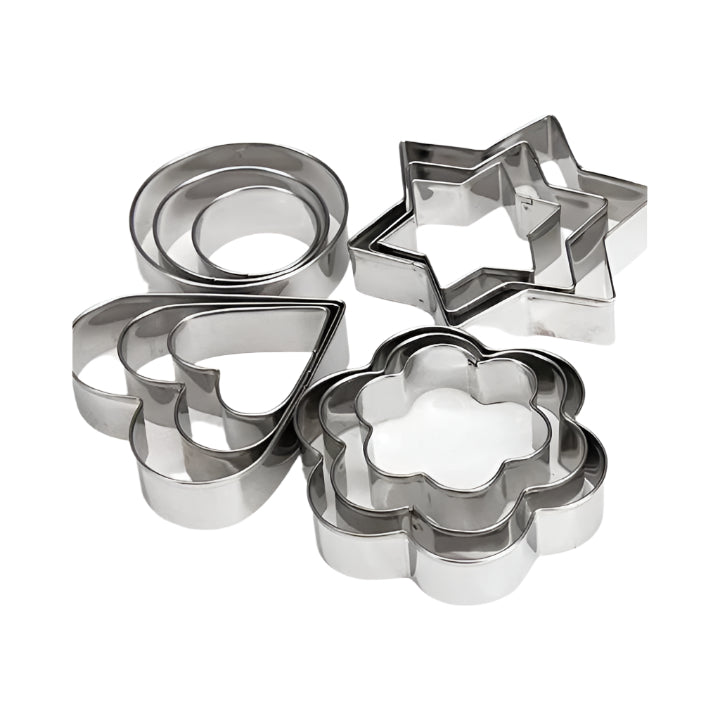 Set of metal cookie cutters including circles, stars, and a flower on a white background