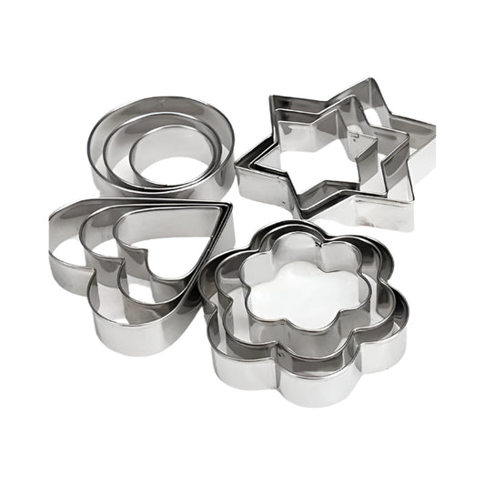 Set of metal cookie cutters including circles, stars, and a flower on a white background
