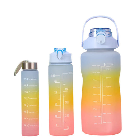 Gradient colored water bottles with measurement markings on a colorful background