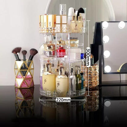 Makeup organizer with various products on a reflective surface, with a vanity mirror in the background.